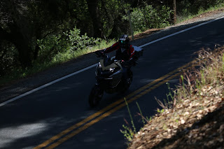 Coach Can riding his Ducati Multistrada into a corner