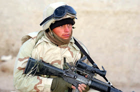 HELMAND PROVINCE, Afghanistan (Jan. 01, 2002) -- A U.S. Marine with Battalion Landing Team 3/6, 26th Marine Expeditionary Unit (Special Operations Capable), helps conduct a Cordon and Search Raid at a suspected Al Qaeda hideout in the Helmand Province of Afghanistan.