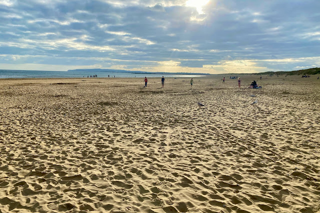 a large stretch of white beach at Camber Sands in East Sussex