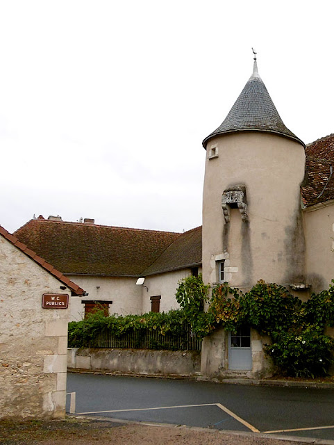 Medieval tower with jakes (toilet) next to modern public toilets, Indre, France. Photo by Loire Valley Time Travel.