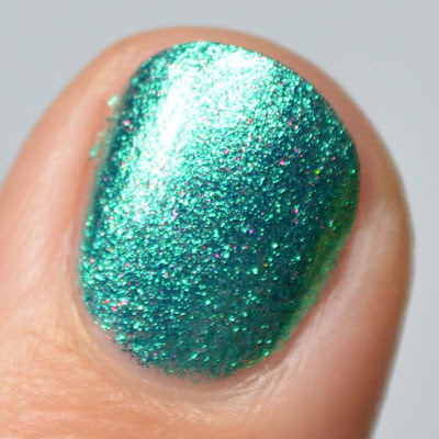 green glitter nail polish swatch