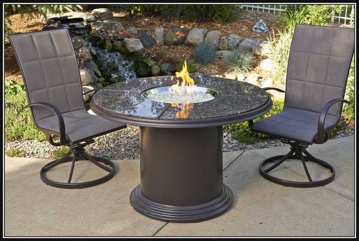 round dining table with fire pit in middle