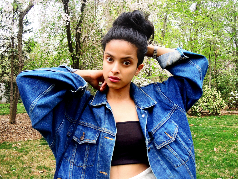 high top messy bun, oversized denim, bandeau top, blue nine west booties, stuart weitzman clutch