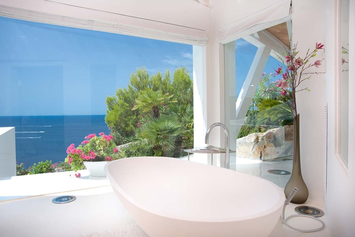 Bathtub by the window in Mediterranean villa in Mallorca by Alberto Rubio