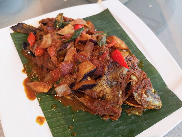 Baked Jade Perch with Tamale Masala Sauce wrapped in Banana Leaf