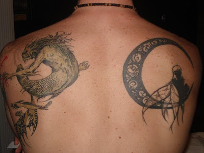 Monster and Moon Tattoo at the back. [Image Credit: Link]