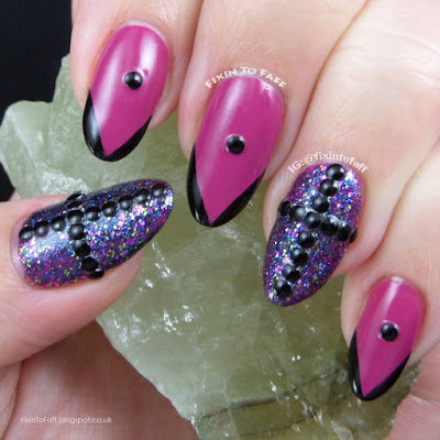 Gothic black and fuchsia nail art.