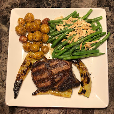 Truffle salted filet mignon, roasted baby potatoes and haricots verts almondine