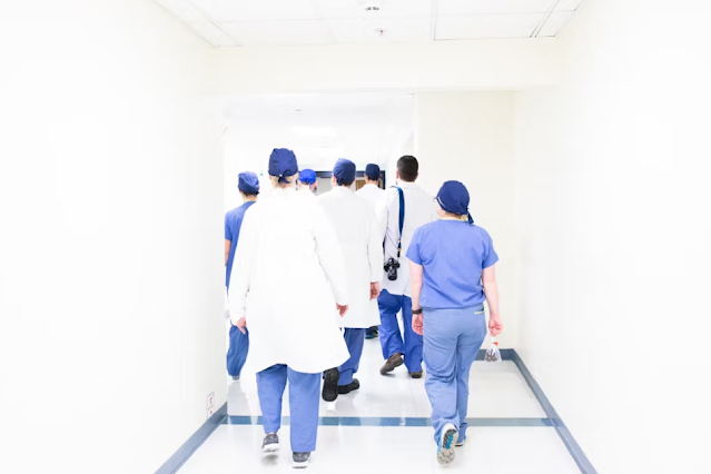 Healthcare workers finishing shift, best stocks to buy, learn a trade