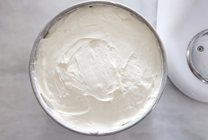 cheesecake batter in springform pan smoothed