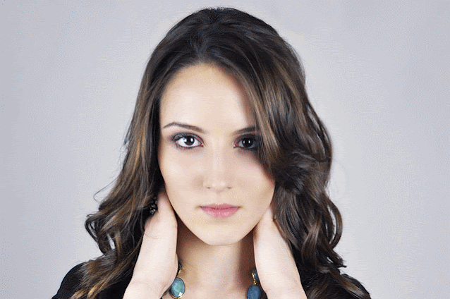 Young woman with striking brown eyes.