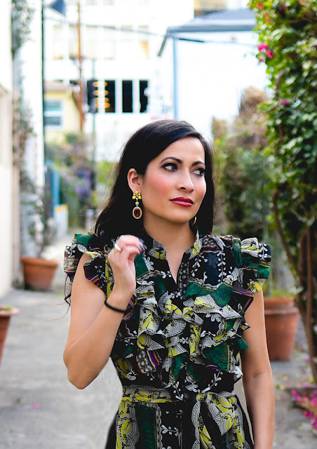 Joanna Joy A Stylish Love Story Blog Fashion Blog California Fashion Blogger tribal print green dress ruffles chunky grommet Sam Edelman black suede heels orange earrings