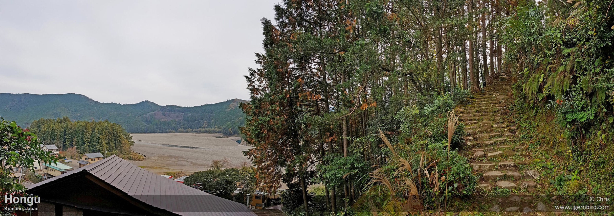 Mossy Kumano Kodo trail on steep hillside to town and stony Kumano riverbed in Japan