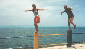 Standing on posts in Isla Providencia, Columbia with beautiful tropical water in background