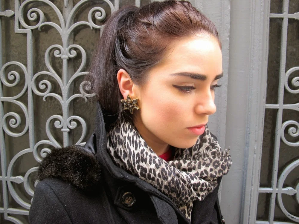 Fashion blogger Emma Louise Layla wearing star statement earrings