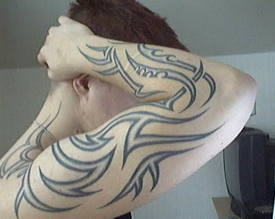 The very name tribal arm tattoos tells you something about these designs