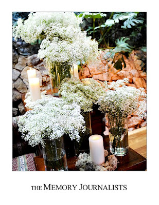 Clusters of baby 39s breath and candles add to the charm of the Shawdowbrook