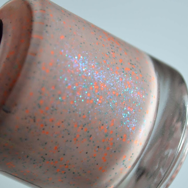 orange peach nail polish with aqua shimmer