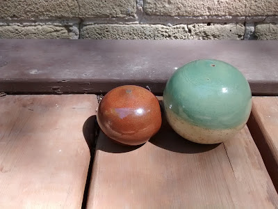 Image of two wheel thrown ceramic spheres