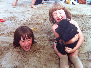 My sister buried in the sand with only her head sticking out