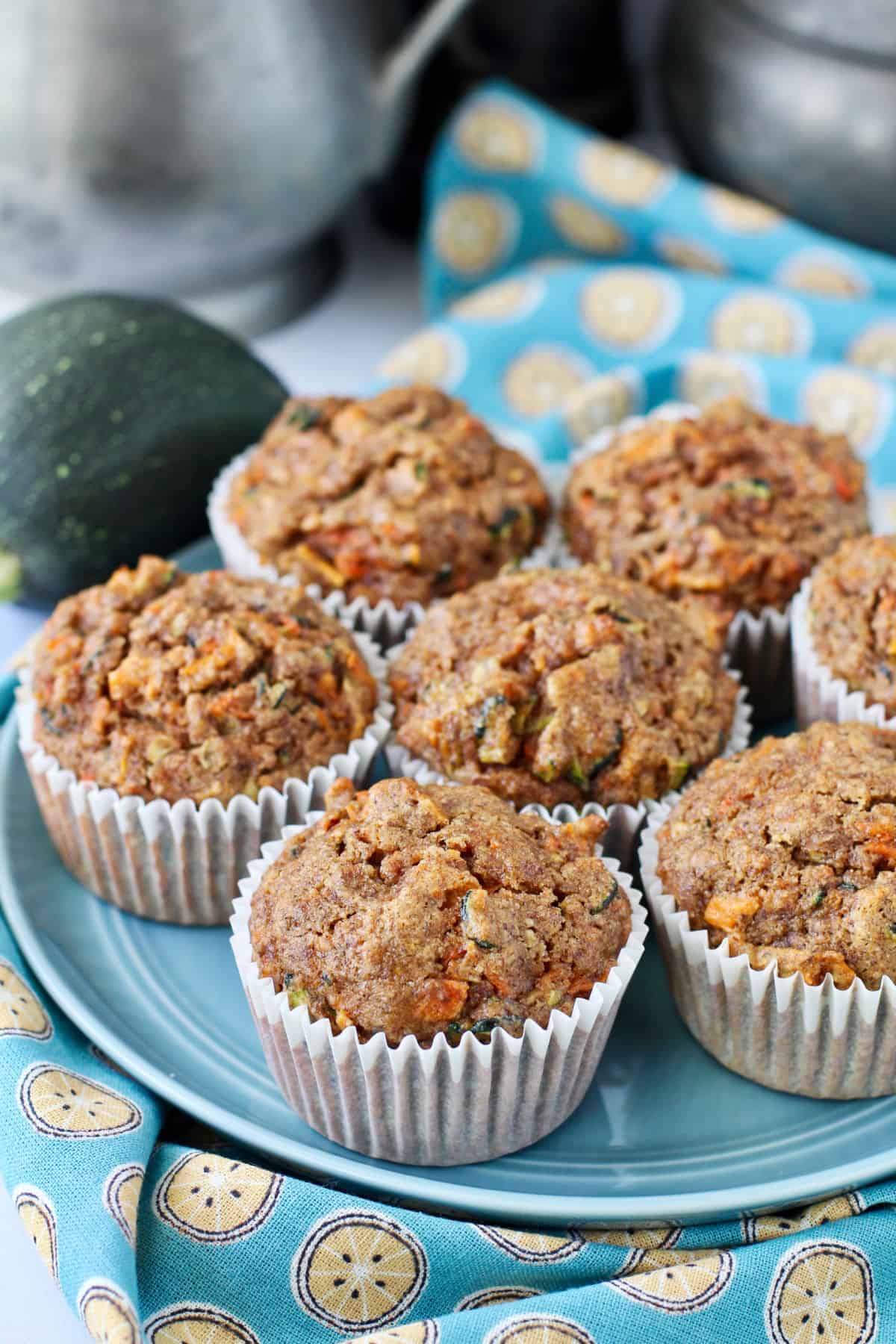 Zucchini Carrot Muffins on a blue plate.