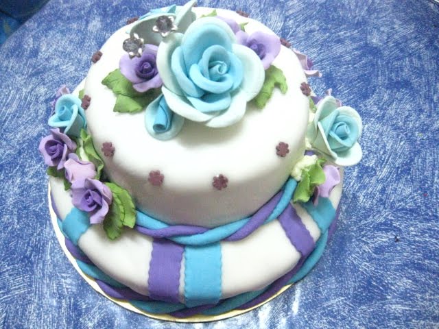 2 tier fondant cake with blue and purple theme ordered by Ms Ayna Mardiah