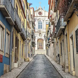 Church viewed from a narrow street in Lisbon