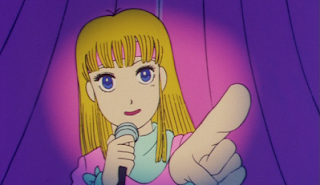 A screenshot of Hibari from "Stop!! Hibari-kun" holding a mic and pointing towards the direction of the viewer.