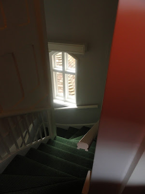 antique stairs down past a window