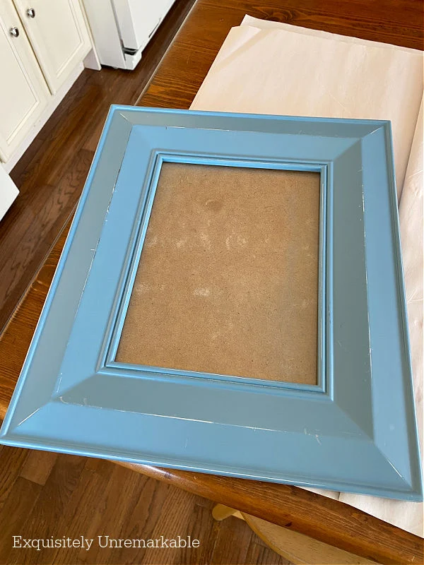 Large Blue Wooden Frame ready for a makeover on a table
