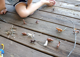 Tessa put her critters to work. The moose has the biggest antlers, so he gets the biggest stick.
