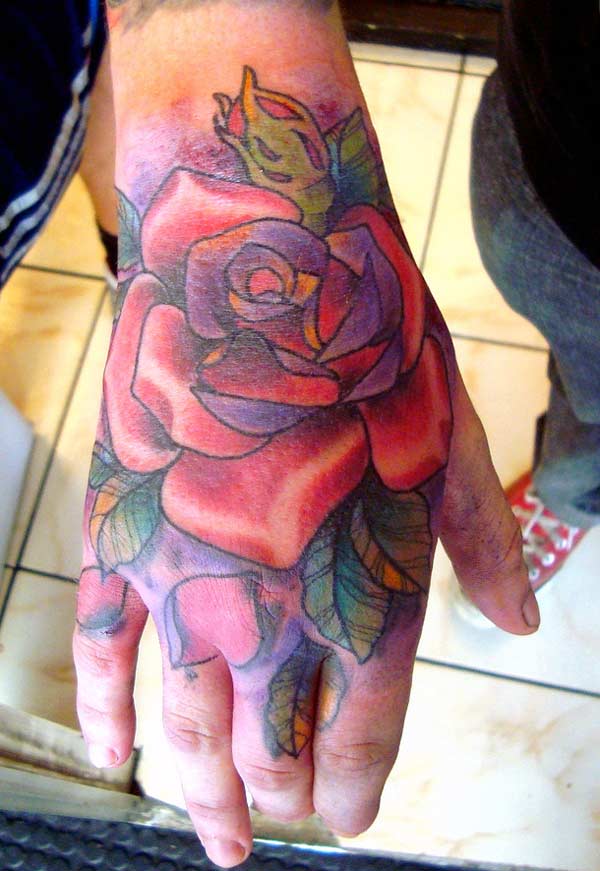 Awesome colorful rose ink tattoo design ideas on the hand for men