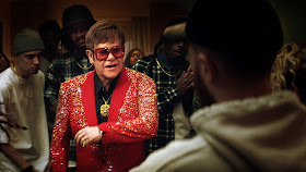 Captain Fantastic Elton John ‘Hits Up’ The Rap Scene In New Snickers Ad