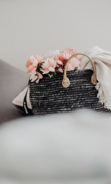 A black small tote handbag.