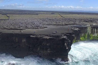 Cliff-top boulders on Ireland’s Aran Islands, moved inland by recent storms. (Image Credit: Peter Cox) Click to Enlarge.