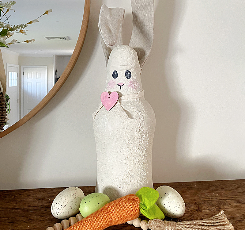bunny on mantel with eggs and carrot