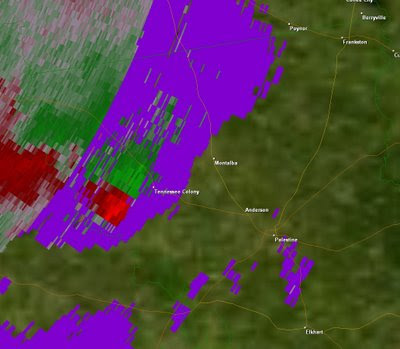 Velocity Data.  Green shows winds moving towards the radar, red away.  This image shows rotation(possible tornado) near Tennessee Colony.