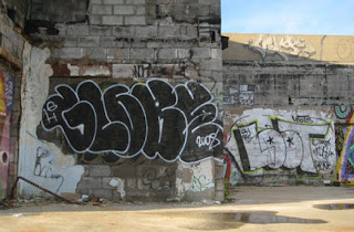 Black Graffiti Bubble Letter On The Wall