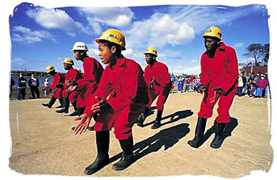 Gumboot dancing performed by mine workers