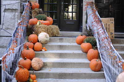 pumpkins and cobwebs on doorstep