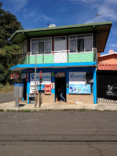 colorful street corner drug store in Puriscal