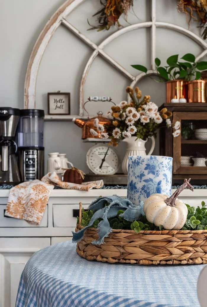 blue and white decoupaged candle, basket, coffee bar