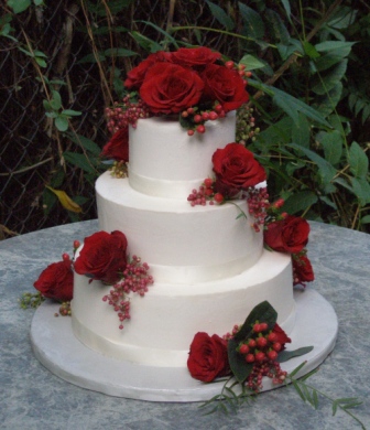 champagne colored wedding cakes with burgundy flowers