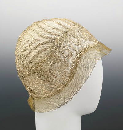 Beige lace 1925 evening cloche designed by House of Lanvin displayed on mannequin head