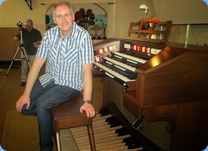 Chris Powell checking-out the Allen TH300 Theatre Organ during preparations for the Concert. Photo courtesy of Dennis Lyons.