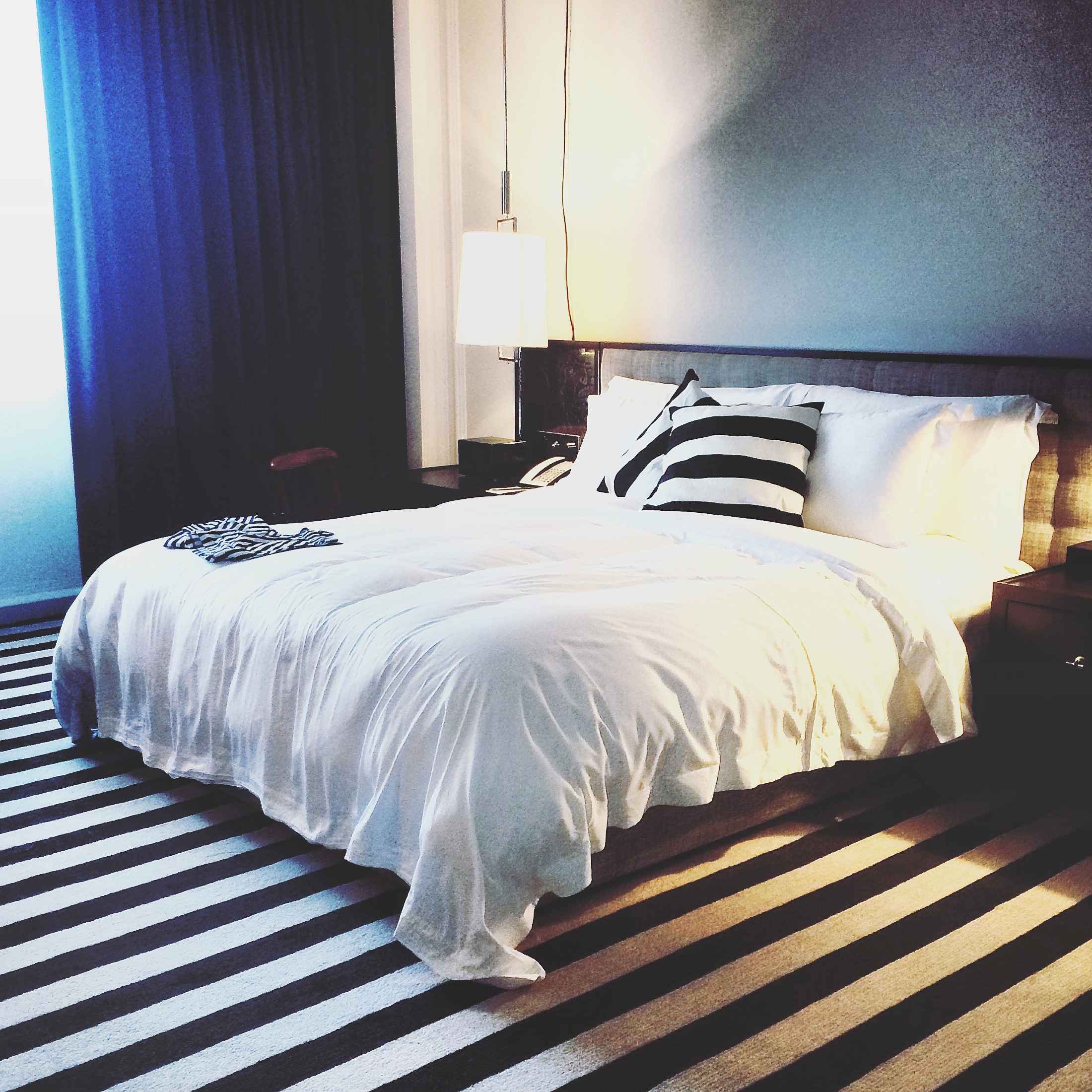 bedroom featuring striped carpet at the rosewood hotel in london