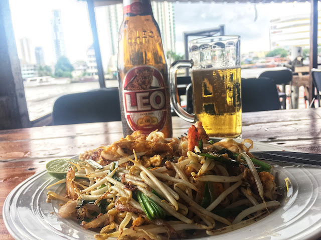 a plate of pad Thai and a Leo beer at Jack's Bar in Bangkok, Thailand