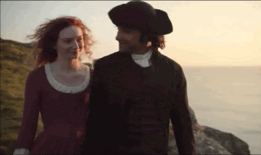Demelza and Ross Poldark share a kiss after the pilchard catch on the cliff top