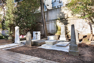 Five renovated American tombs: 1, front row (left); 2, middle row (center); 2, back row (center).