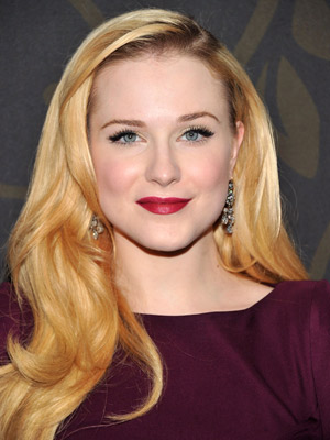 Evan Rachel Wood takes the retro route with a deep side part and brushed-through glamour waves.